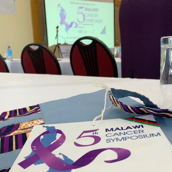 Ryan Wilkins attends a cancer symposium in Malawi.