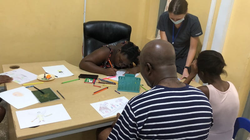 Shelby Cobb helps patients while in Ghana.