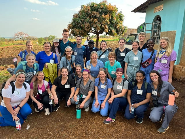 Sierra Simmons (far right in purple), a MUSC College of Pharmacy student completing a project through an award funded by the Center for Global Health in Uganda, poses for a photo with other local team members.