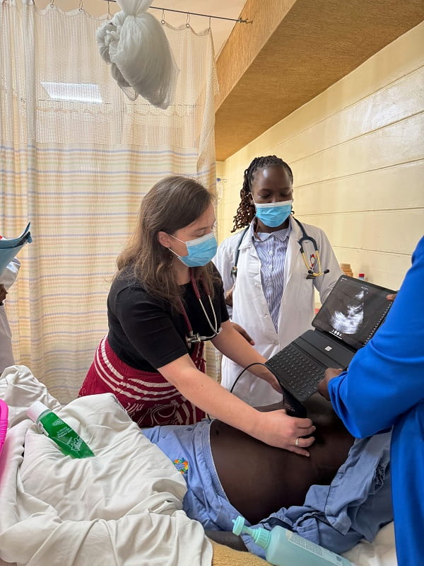 Samantha Puckett completing an ultrasound on a patient while on a global health project in Kenya.