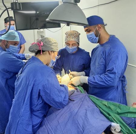 Dr. Stephany Kim participates in a surgery in a mobile unit while on a global health project in Ecuador.