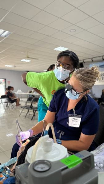 MUSC dental student Gabrielle Martin observes during a dental procedure while on a global health project in Costa Rica. 