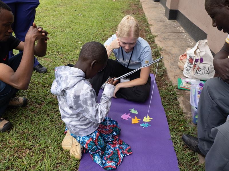 MUSC student Sonora Snook speaks with a patient during a global health project in Masindi, Uganda.
