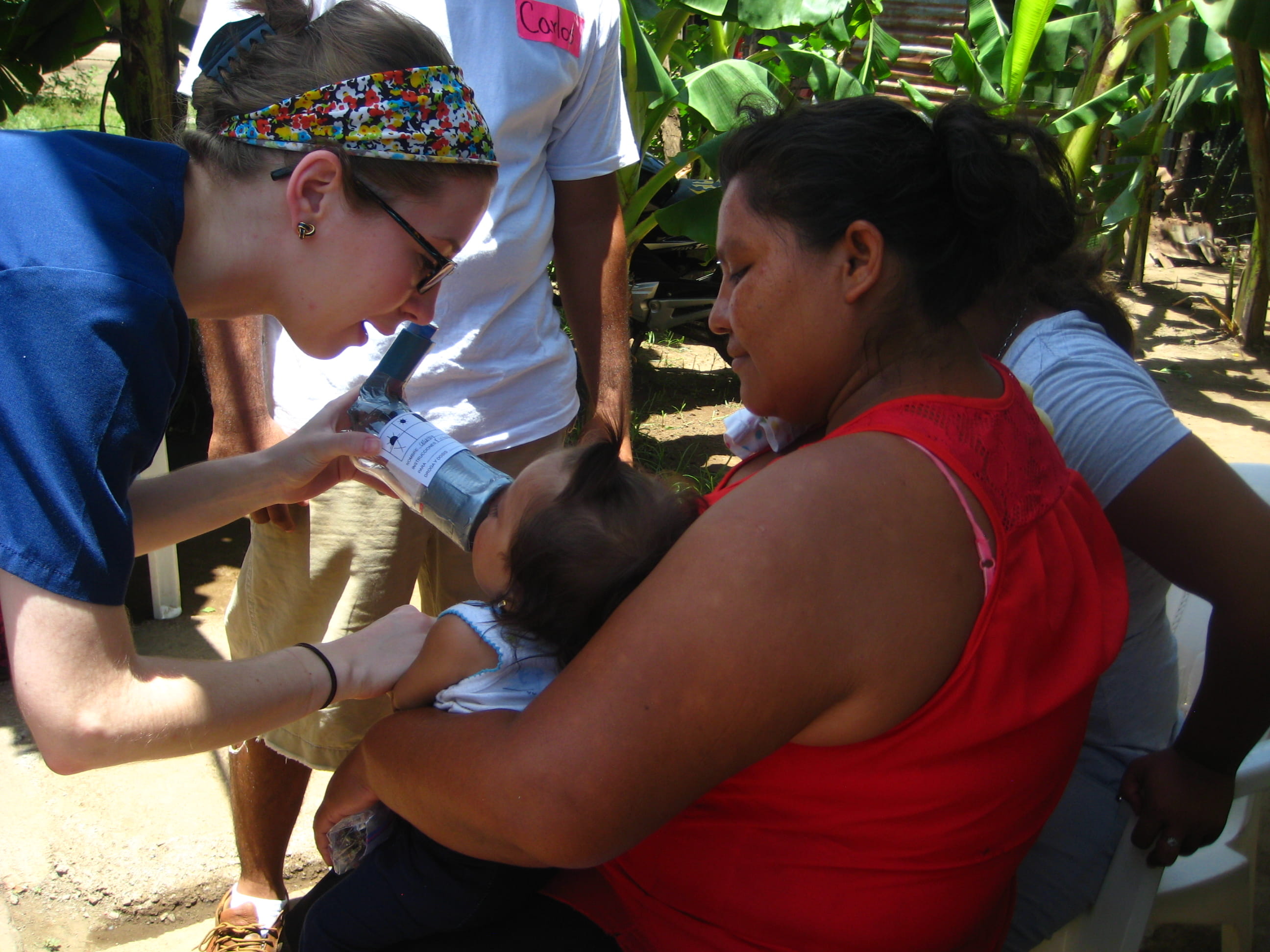 MUSC Physical Therapy student helping a child in Nicaragua