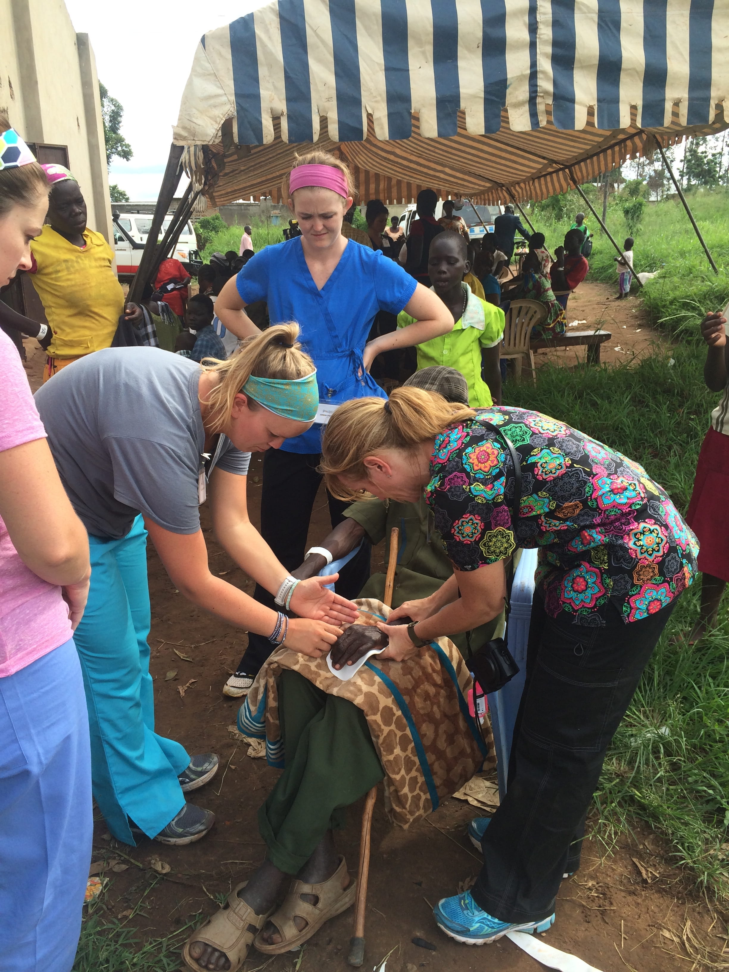 MUSC Health Profession students help make a splint for a local in Haiti