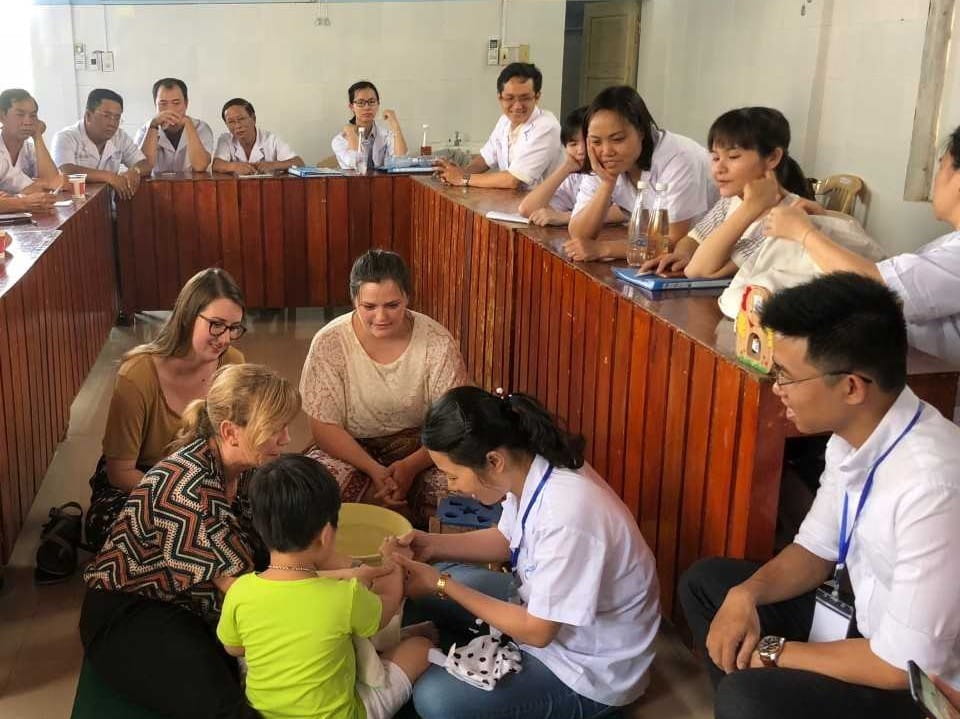 Students work with local healthcare professionals in Vietnam.
