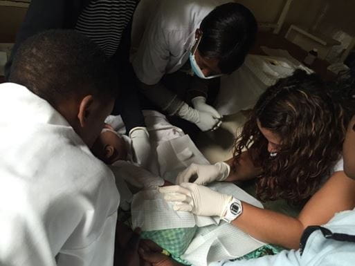 Health professions exam a baby.