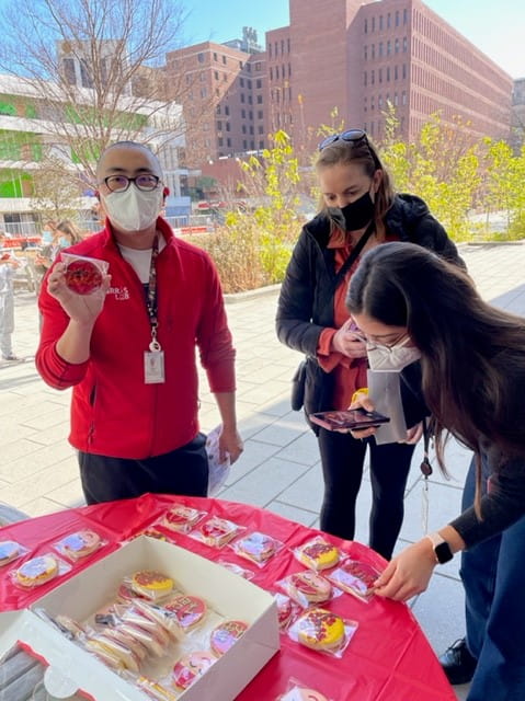 A MUSC community member poses with a Lunar New Year cookie.