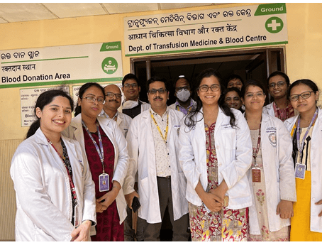 Ipsita with local health workers in India.