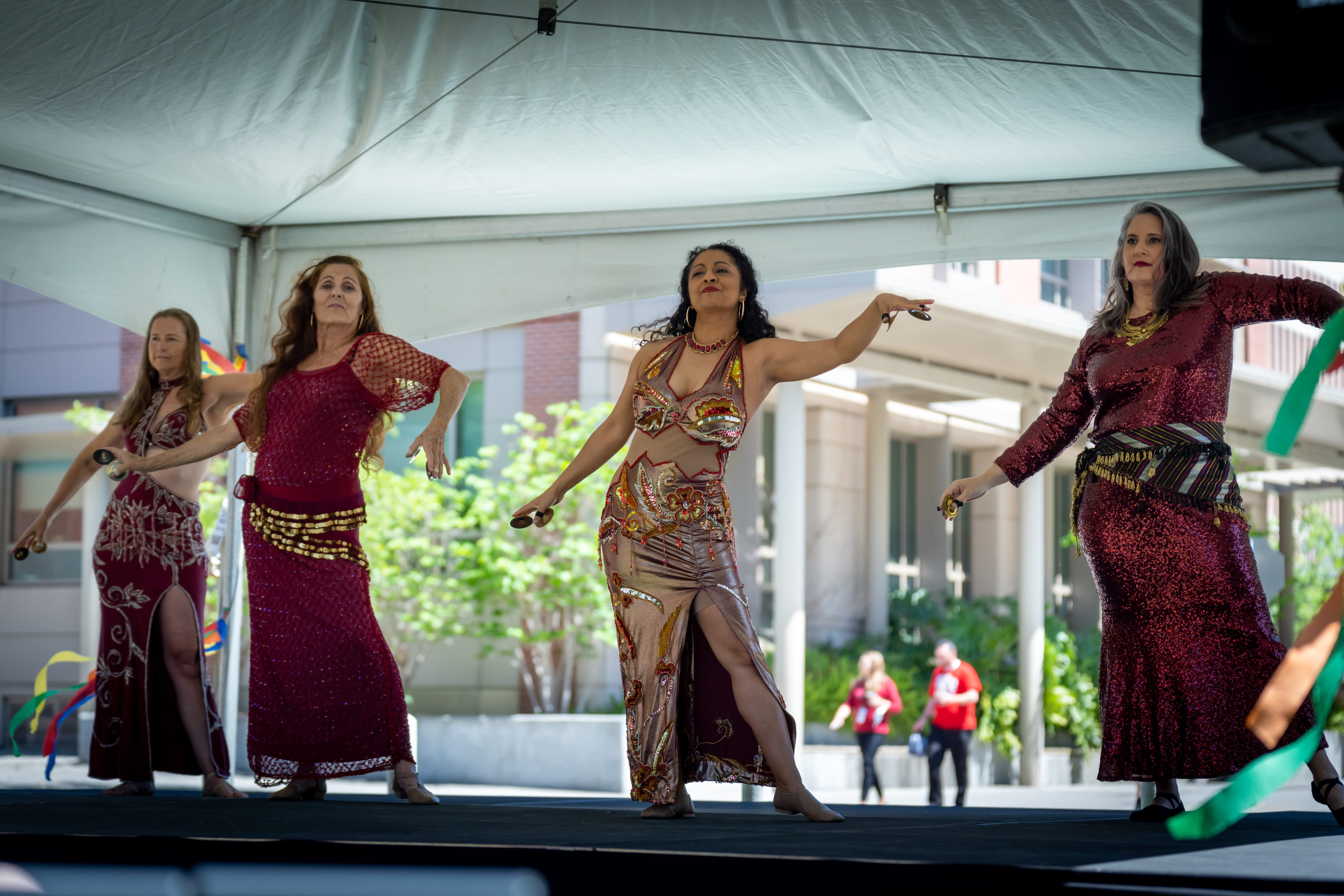 Dancers perform traditional middle eastern belly dancing.