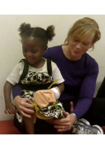 Patty Coker Bolt works with a child.