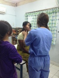 Victoria Way conducts an eye exam in Thailand.