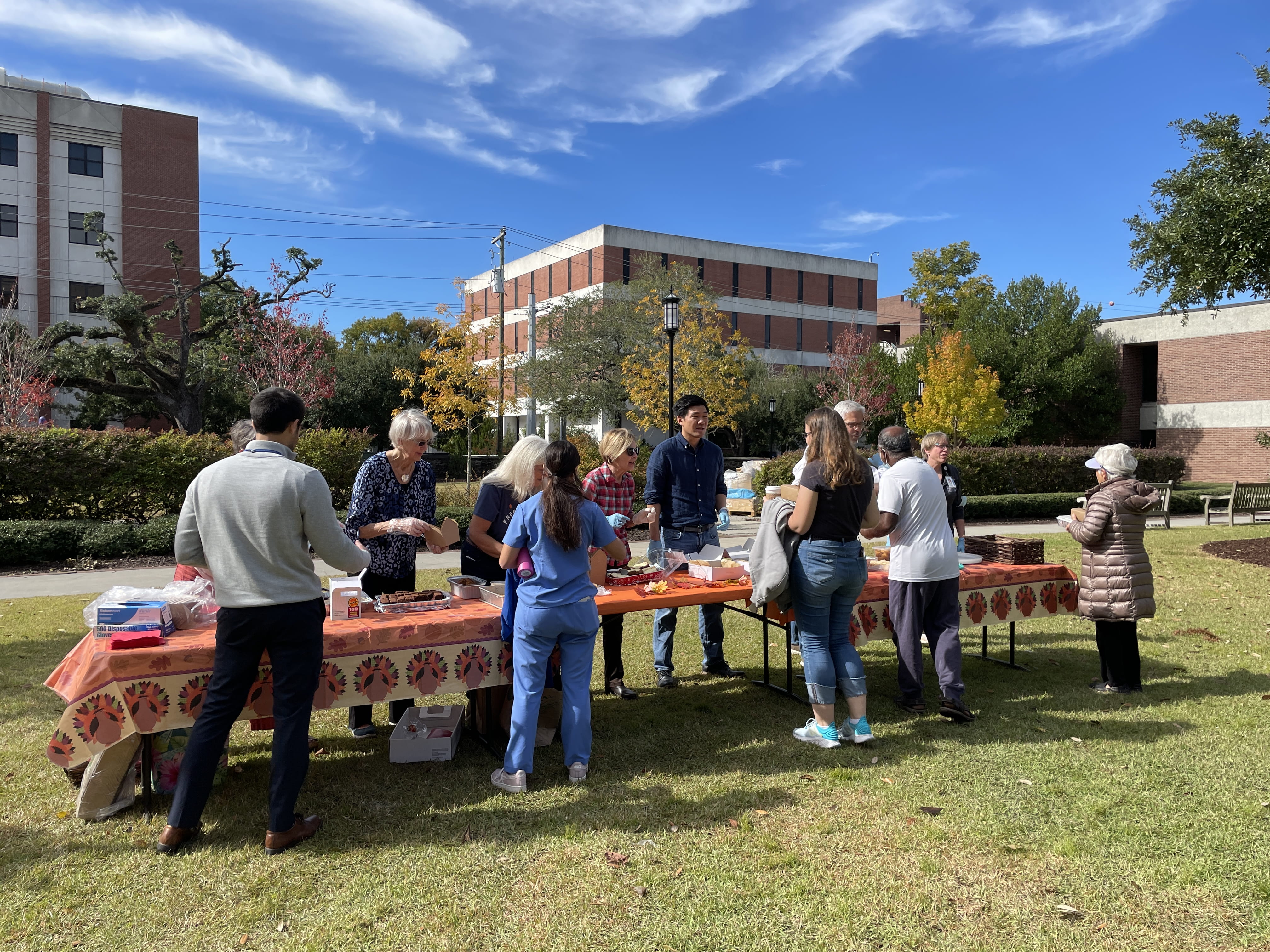 Volunteers serve food at Thanksgiving.