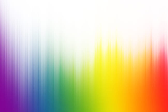 Rainbow colors with white rays of light blend to create abstract background