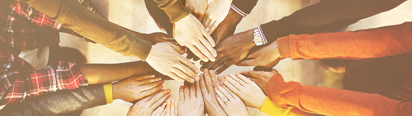 Multi-ethnic diverse group of people hands in circle concept