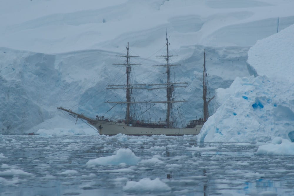 image of antique ship in icy water