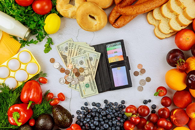 Purchasing healthy food with cash, debit or credit card.