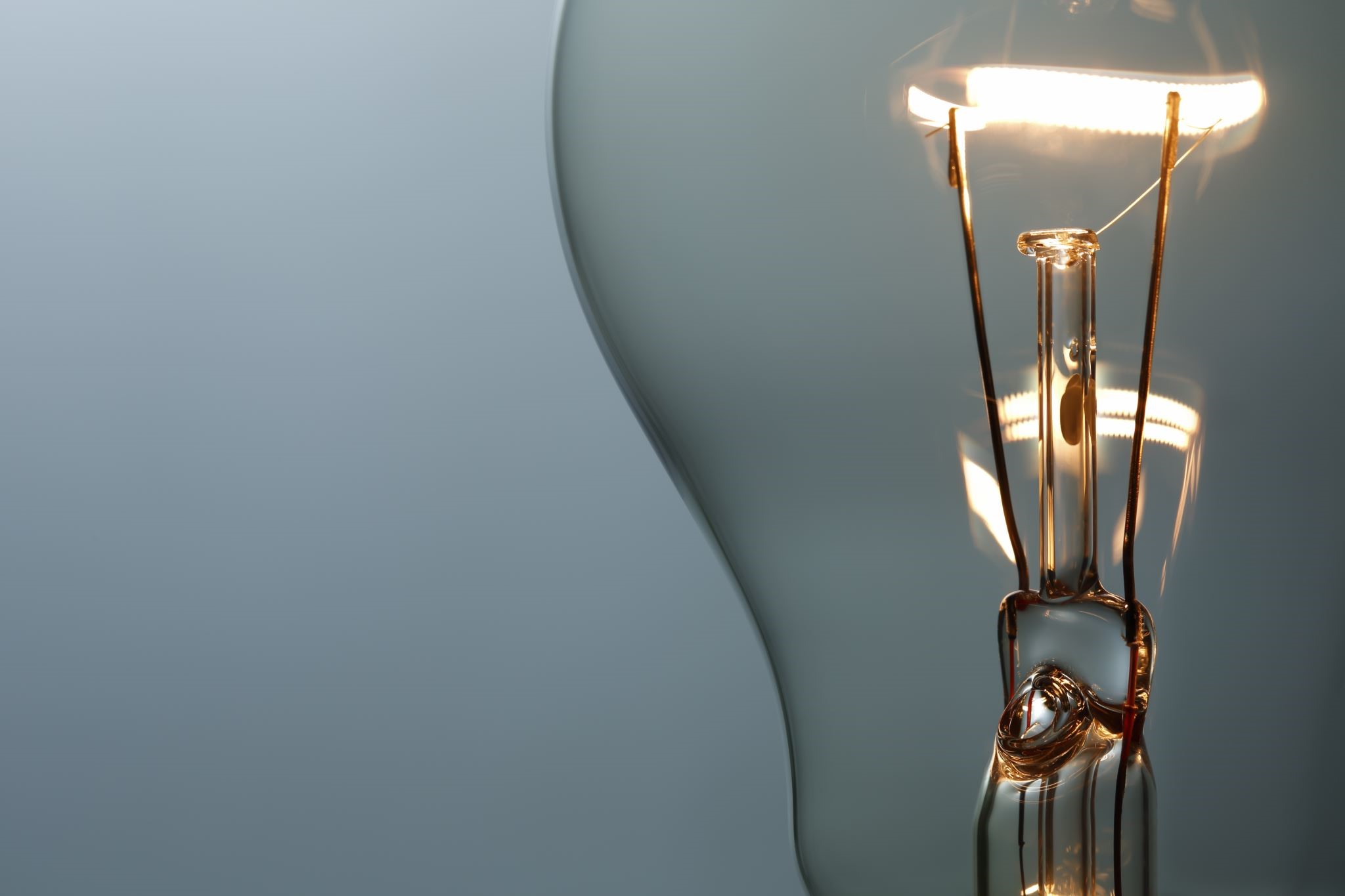 A lit incandescent lightbulb.
