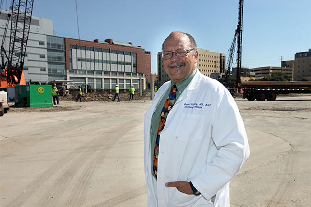 Dr. James Tolley in front of construction site for the MUSC Children's Hospital