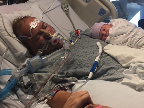 Newborn baby Levi placed on his father's chest while Donnie Yavelak is unconscious in ICU. 
