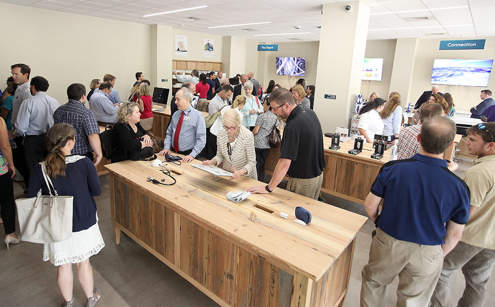 people browse through an upscale-looking tech store