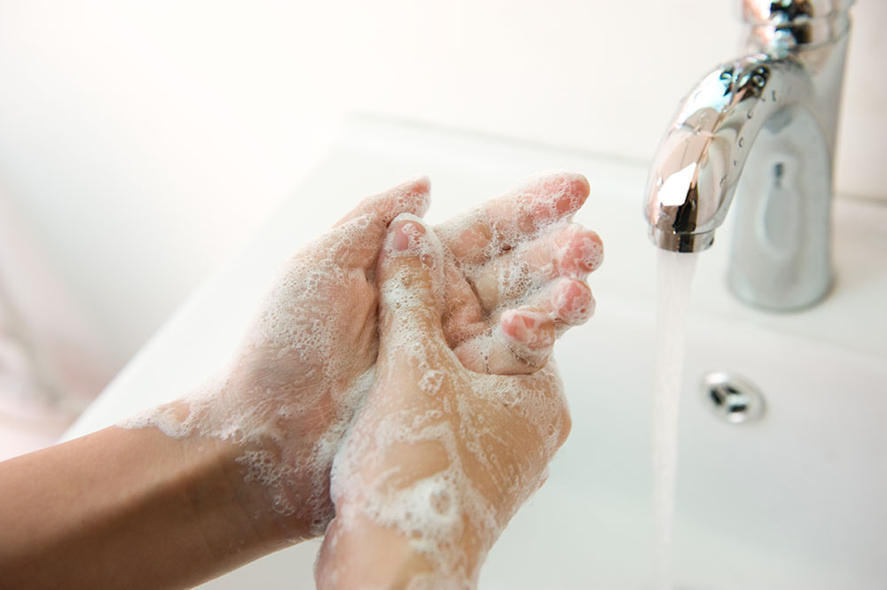 soapy hands in sink