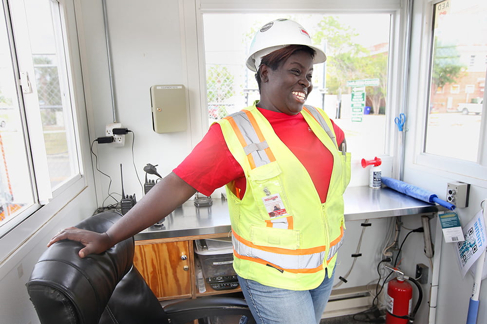 Tiffany Smalls in safety vest and hard hat 