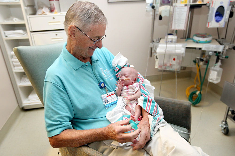 Volunteer holds baby