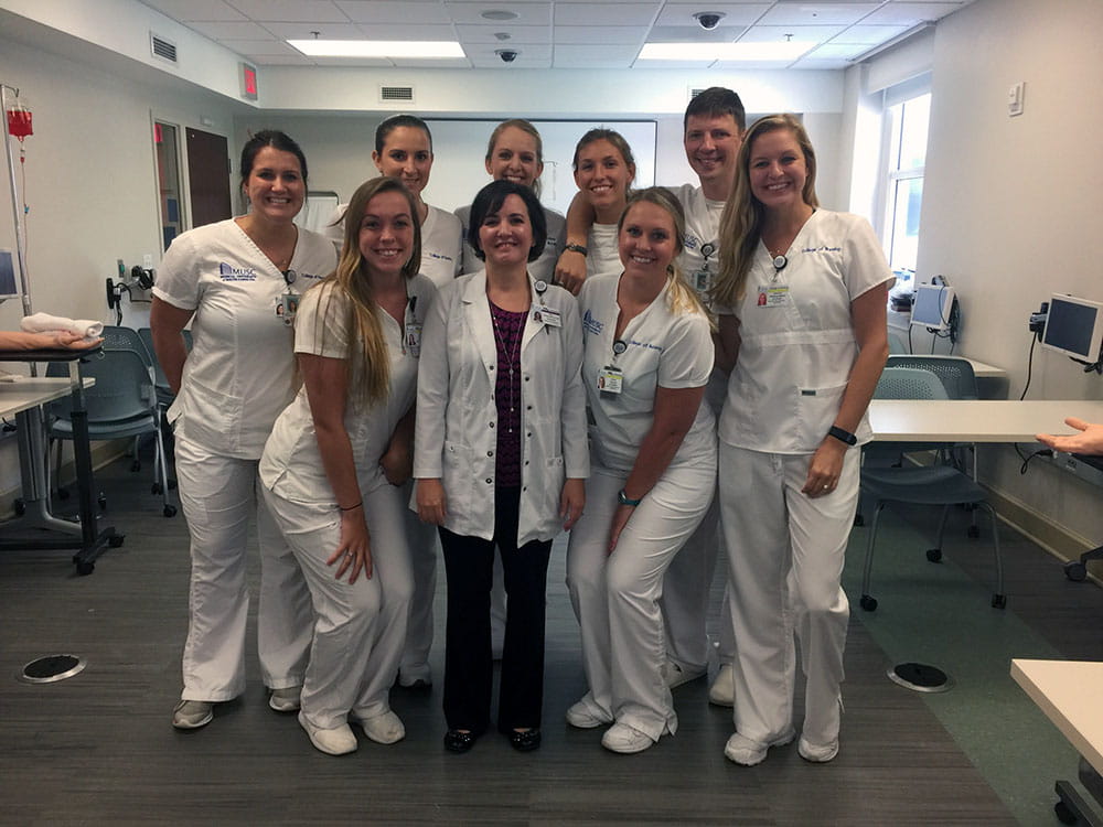College of Nursing's Alex Brown, back row far right, with med/surg 1 clinical group, including nursing supervisor Amy Gulledge.