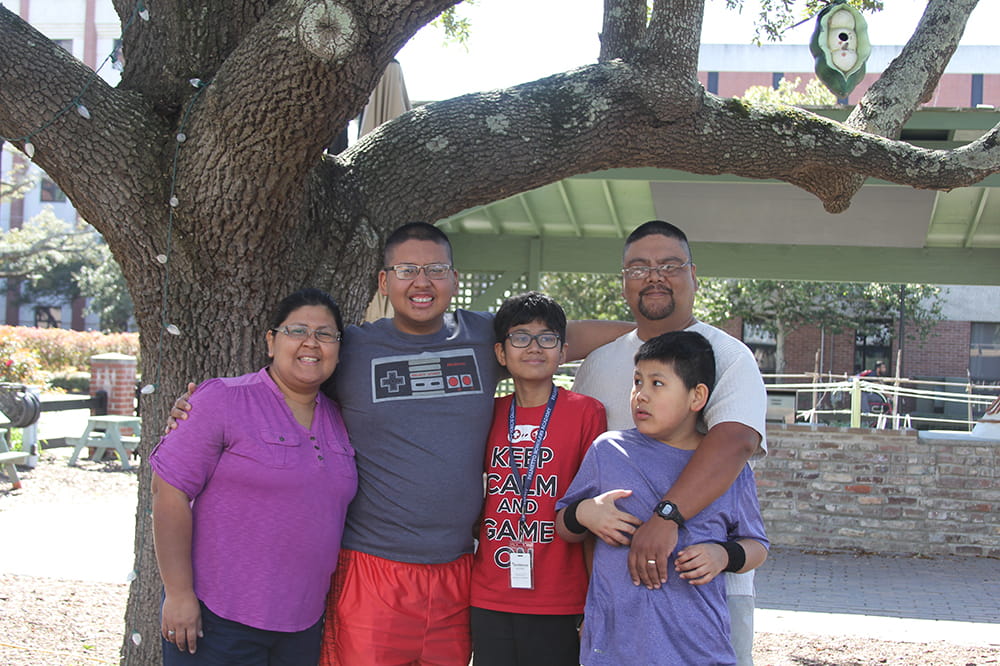 group photo of Vanessa and Miguel Mata and their three boys