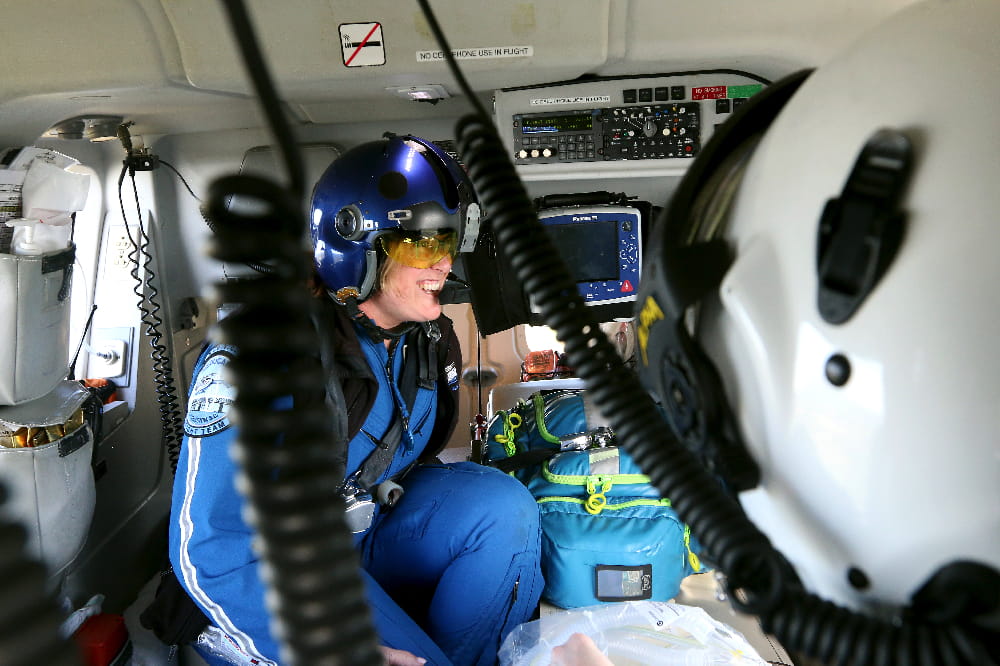Inside MEDUCARE One as flight nurses give care to a patient.