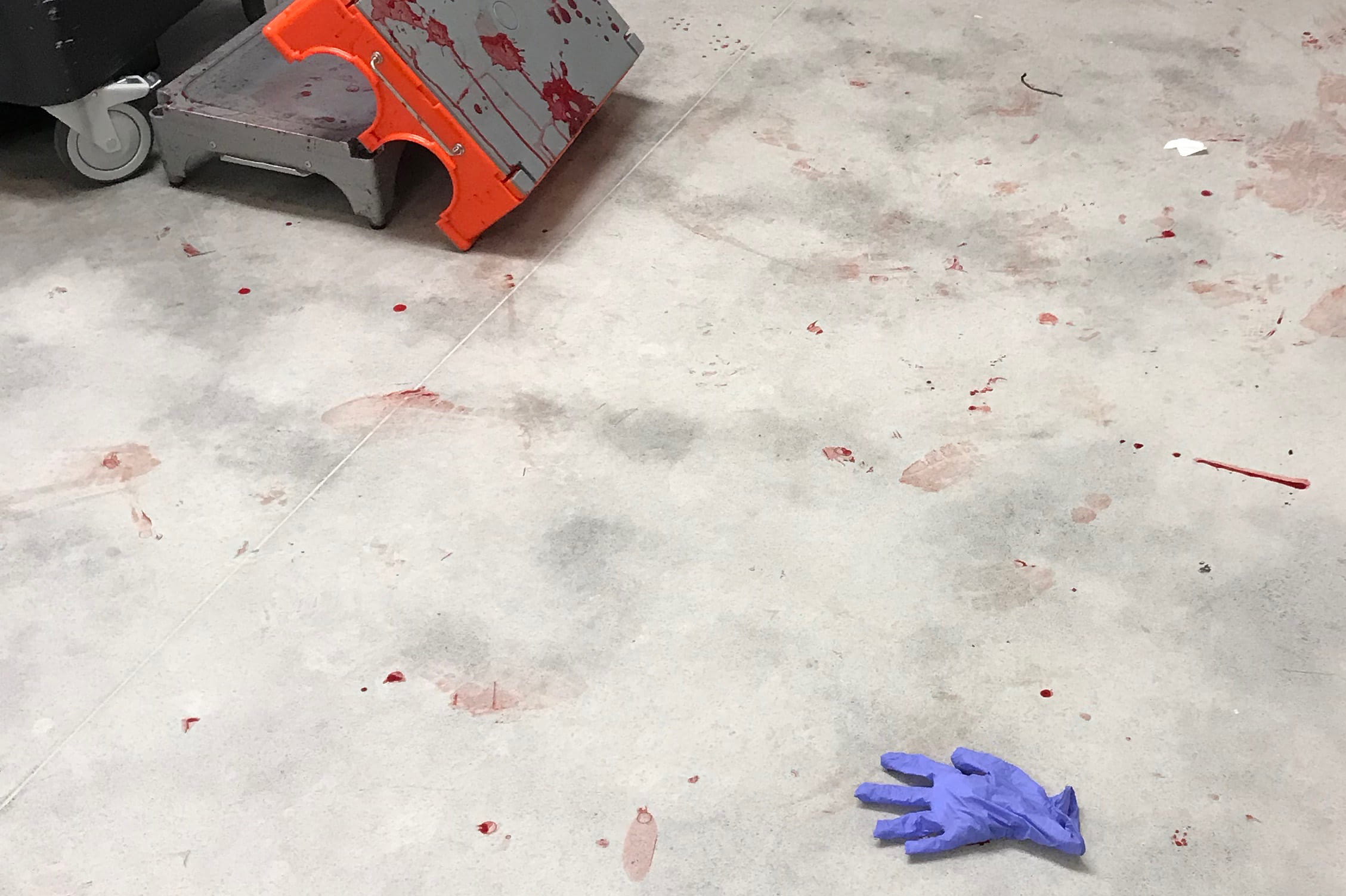 A lone latex glove on floor of OR