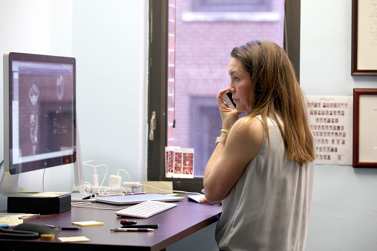 Evans on phone in her office