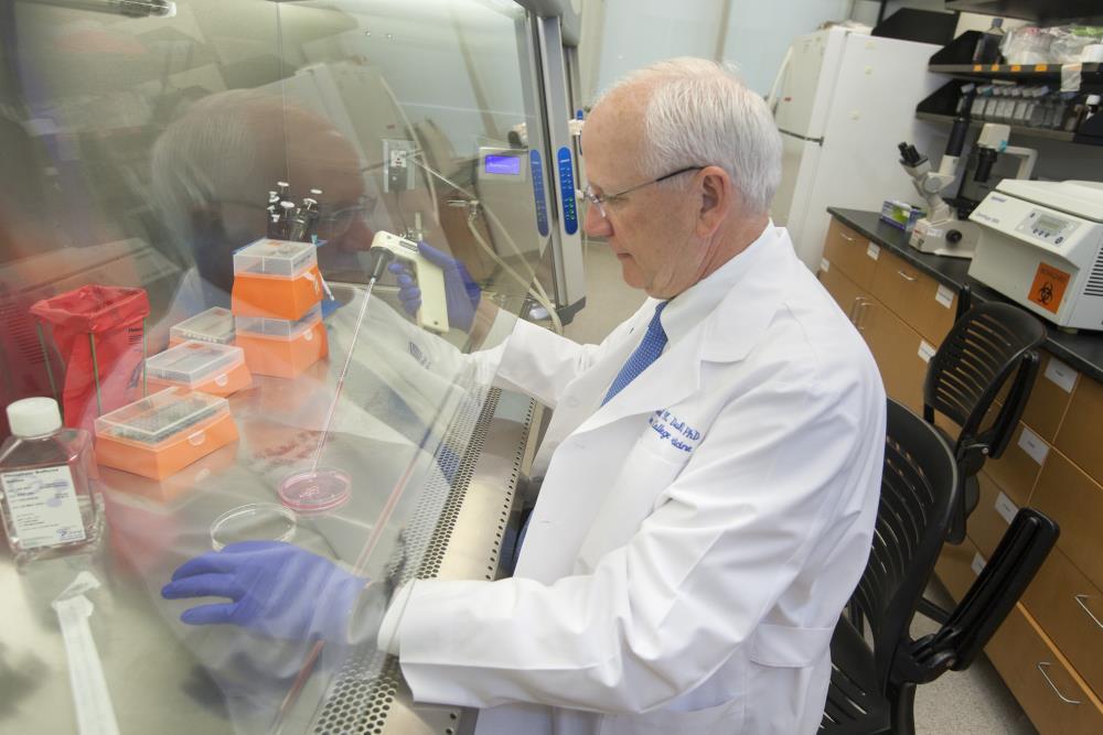 Dr. Raymond Dubois, noted cancer researcher and dean of the MUSC College of Medicine, in the laboratory.