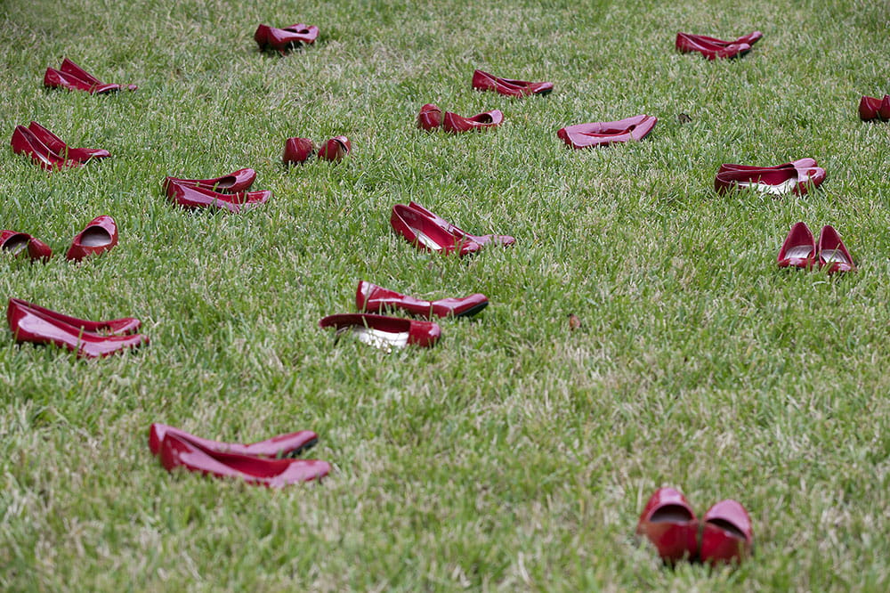 Red shoes represent women murdered by domestic partners
