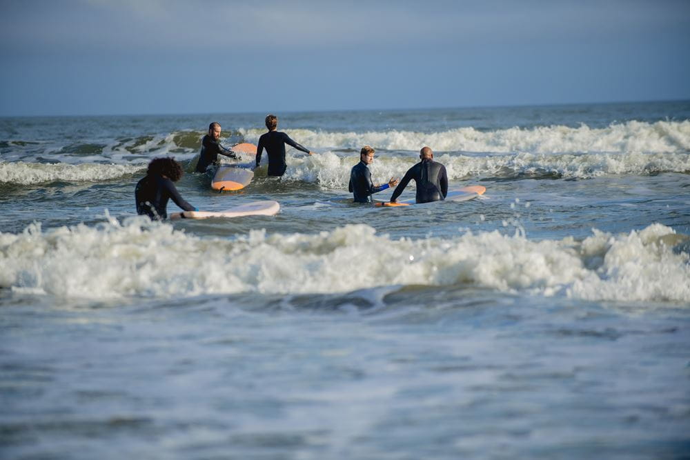Veterans learns the art of surfing with help from Warrior Surf Foundation instructors. Photo courtesy of Warrior Surf.