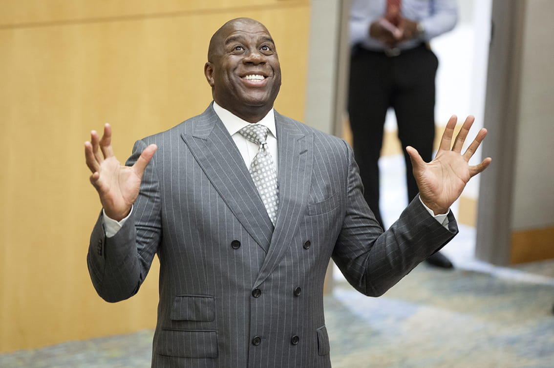 Magic Johnson smiles as he speaks to a group of employees at MUSC