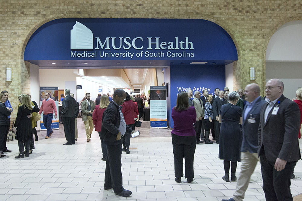 People walk around entrance of MUSC Health West Ashley Medical Pavilion