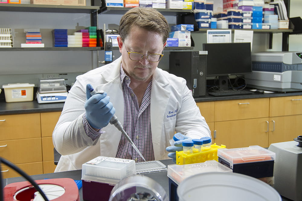 Dr. Eric Daniel Hamlett, lead author of the Glia article, in his laboratory at the Medical University of South Carolina.