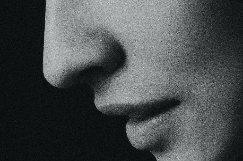 Woman's nose and mouth in black and white photo