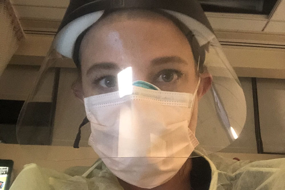 Nurse Caroline Wright wears a face shield during her 12-hour shifts taking care of COVID-19 patients in New York.