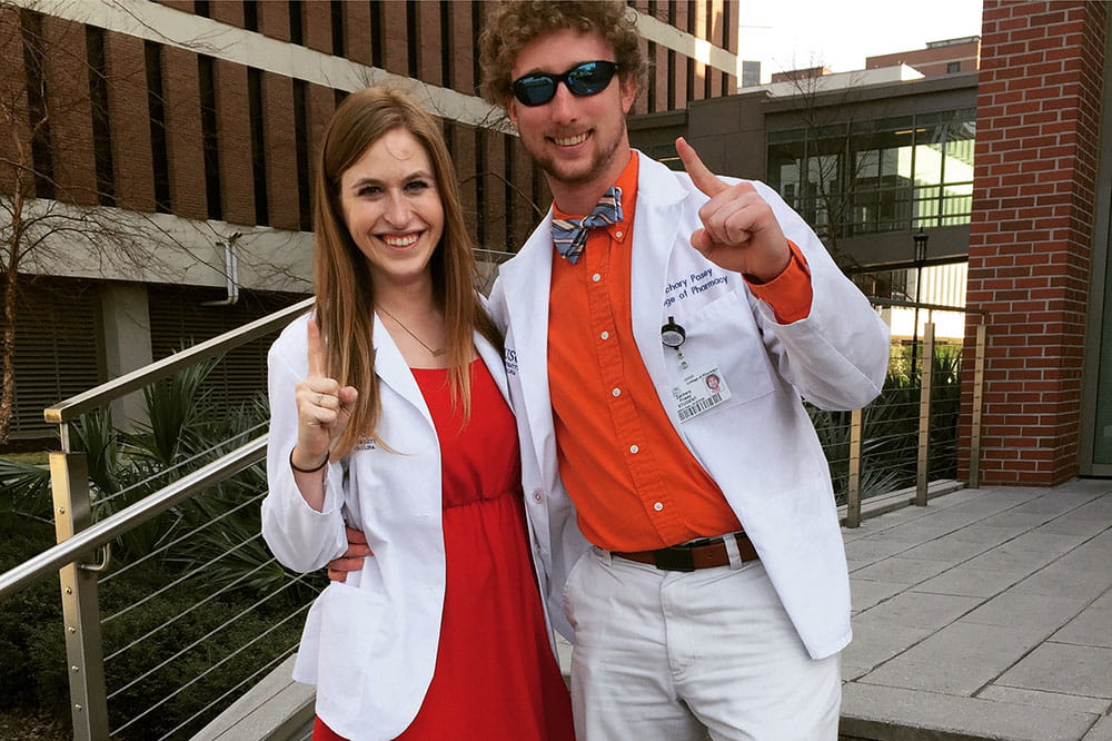 Austyn and Zachary Posey in white coats