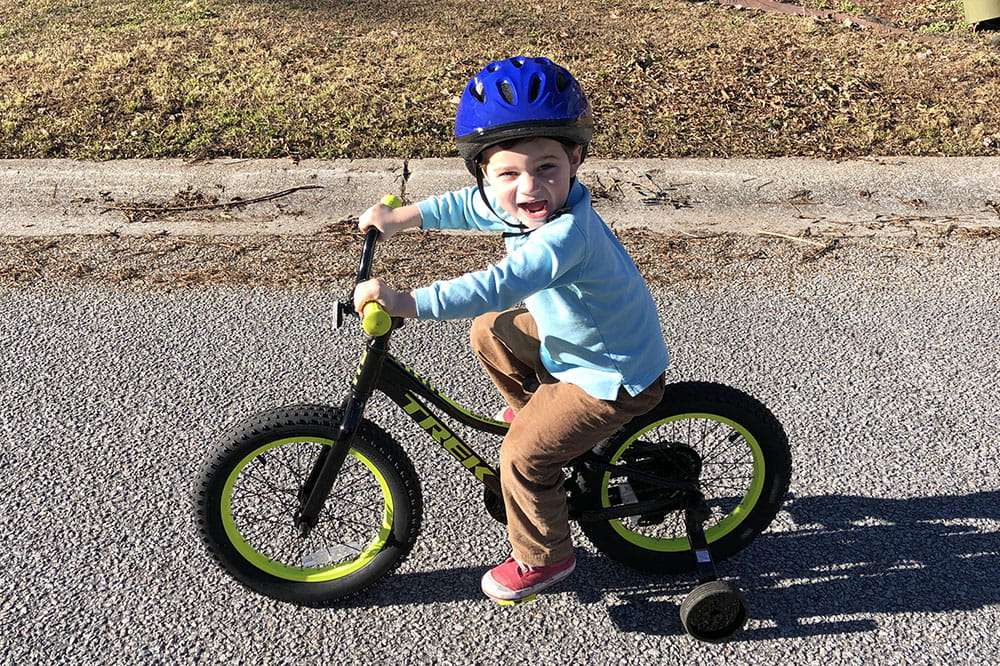 Henry Parker riding his bike
