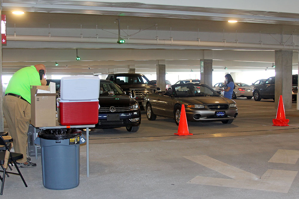 Cars line up for COVID-19 testing at the Charleston International Airport.