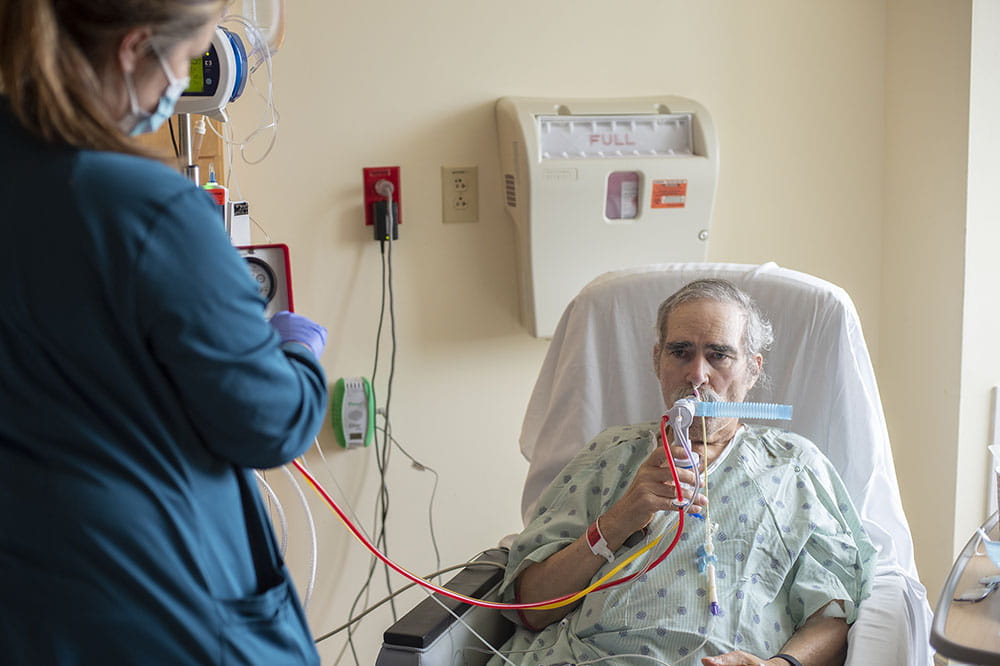 Lung transplant recipient Louis Besse gets a breathing treatment.
