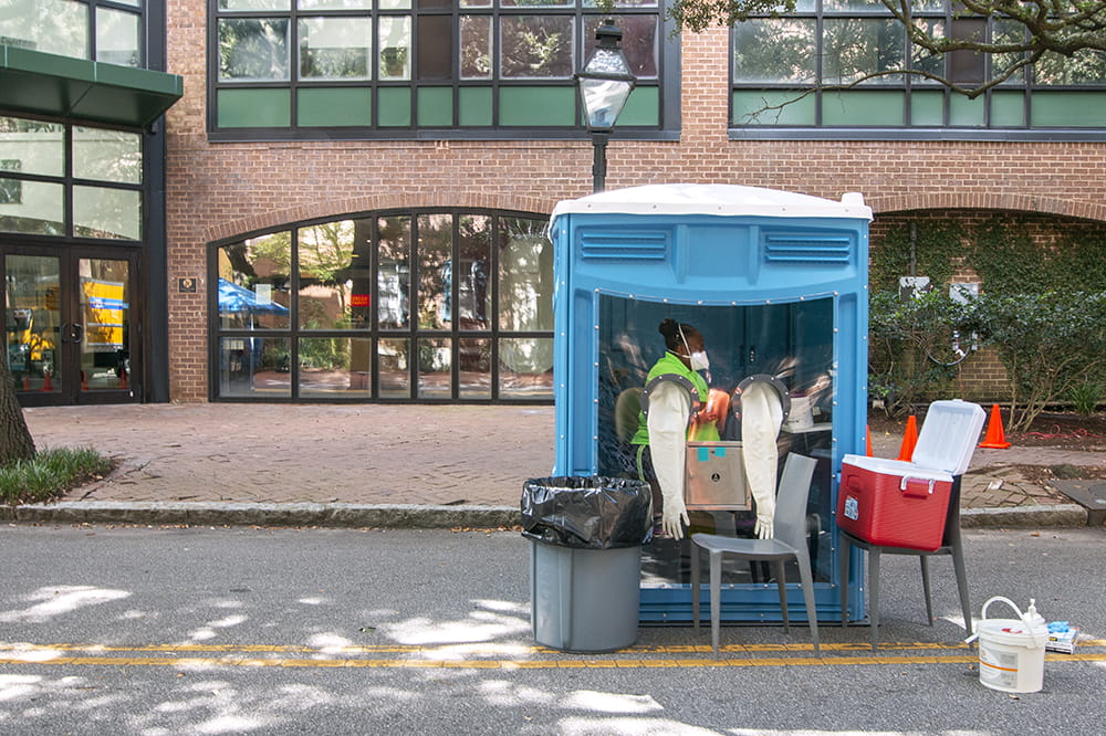 a portable testing unit sits in the street on the College of Charleston campus