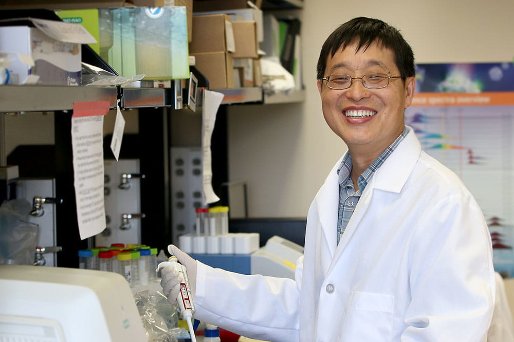 Dr. Xue-Zhong Yu works in his lab