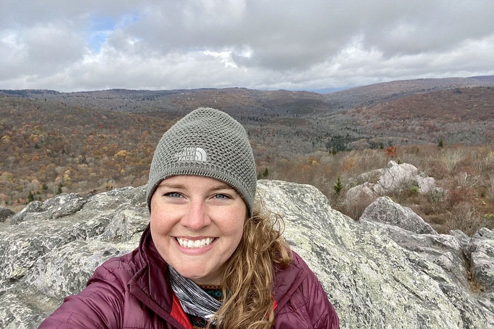 MUSC employee Kelly Warren smiles while hiking.