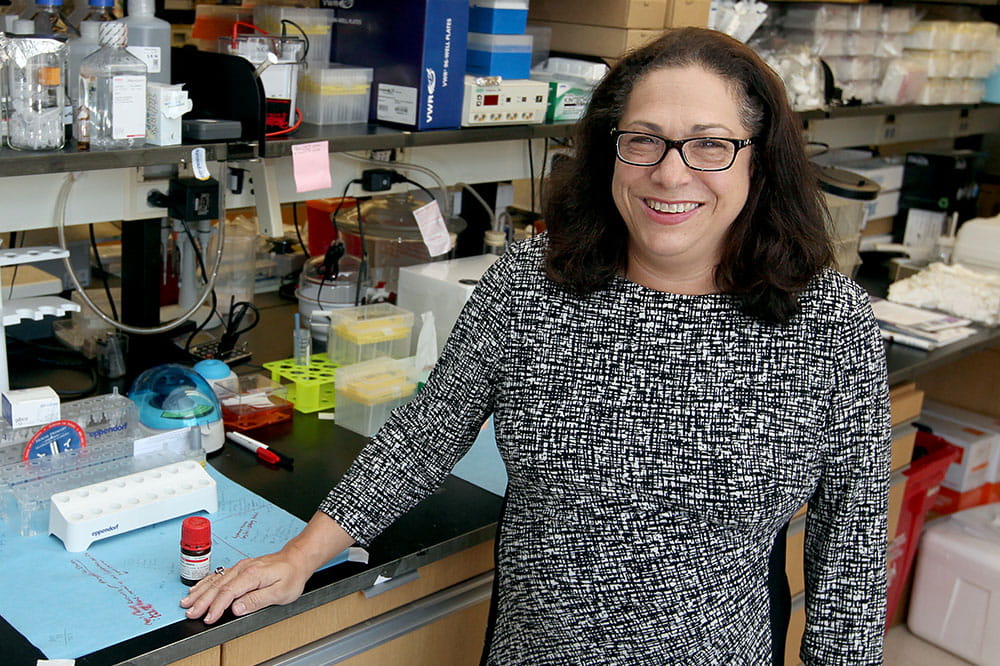 Dr. Nancy Klauber-DeMore stands in her lab