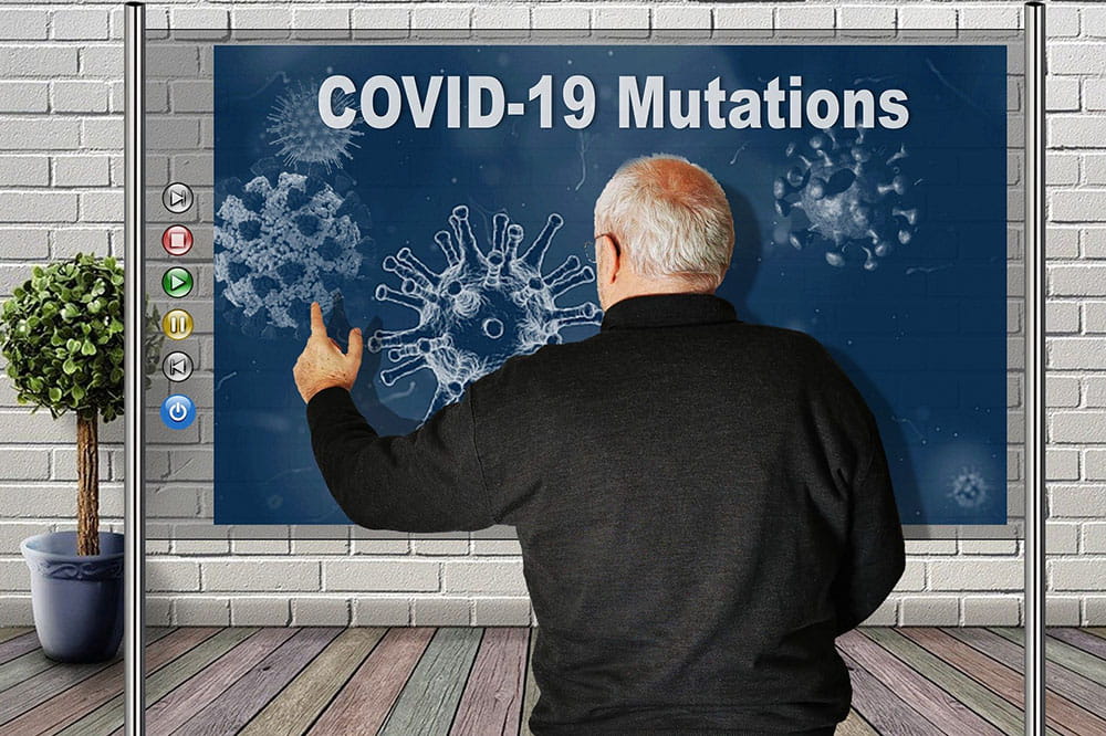 Many points to pictures on a board of COVID during a presentation.